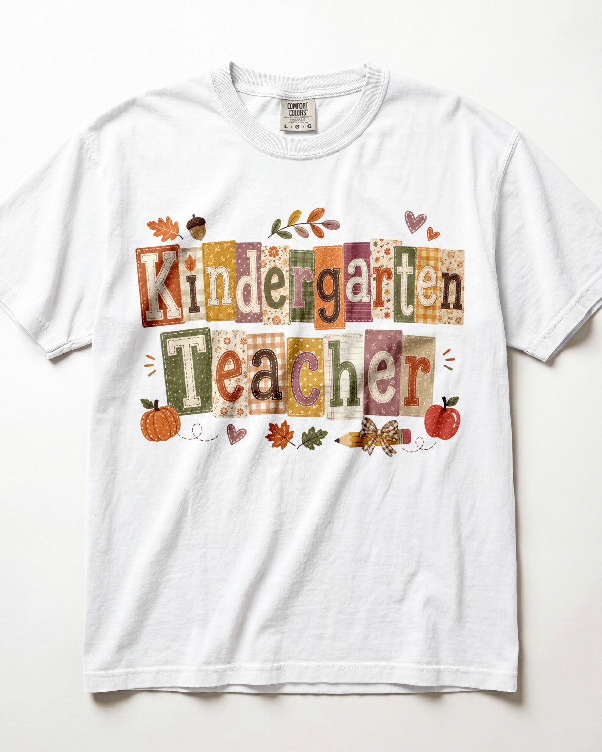 White crew-neck short-sleeve T-shirt with “Kindergarten Teacher” fall graphic print