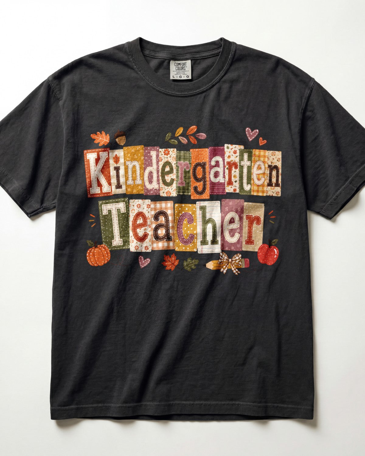 Black crew-neck short-sleeve T-shirt with “Kindergarten Teacher” fall graphic print