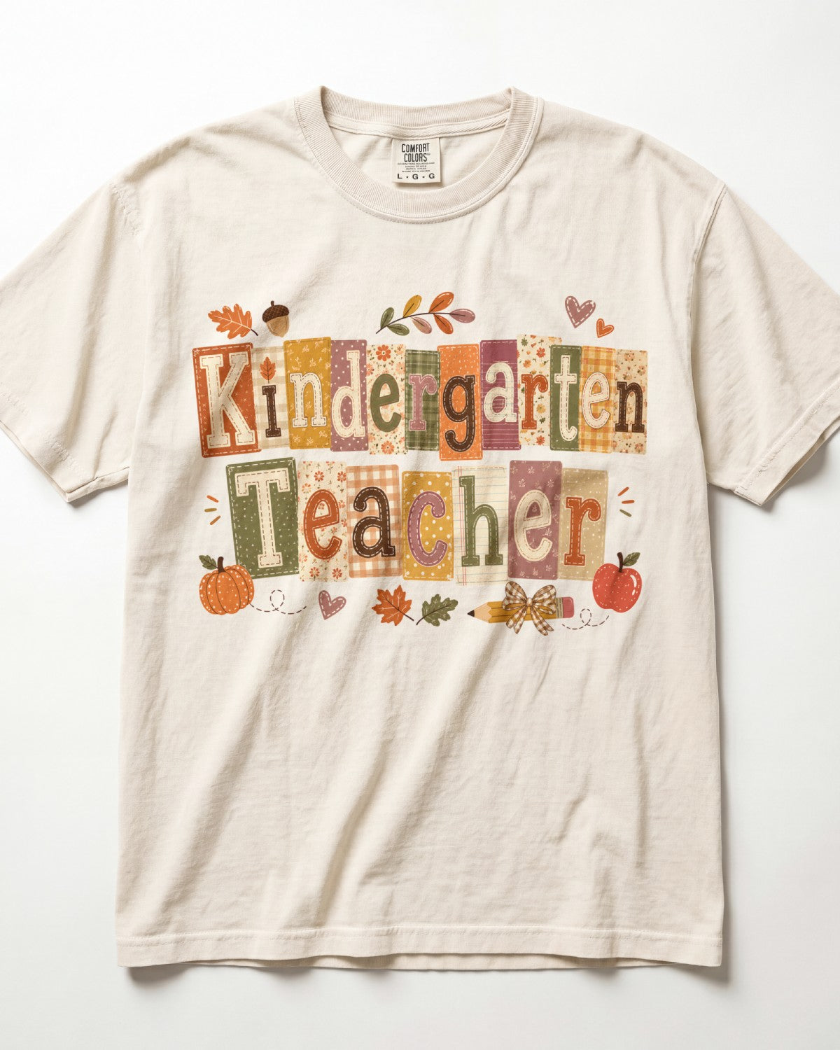 Cream crew-neck short-sleeve T-shirt with “Kindergarten Teacher” fall graphic print