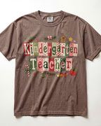 Brown crewneck T-shirt with patchwork Christmas teacher front graphic