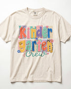 Cream crewneck kids T-shirt with “Kinder Garten Crew” colorful graphic print