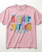 Light pink crewneck kids T-shirt with “Kinder Garten Crew” colorful graphic print