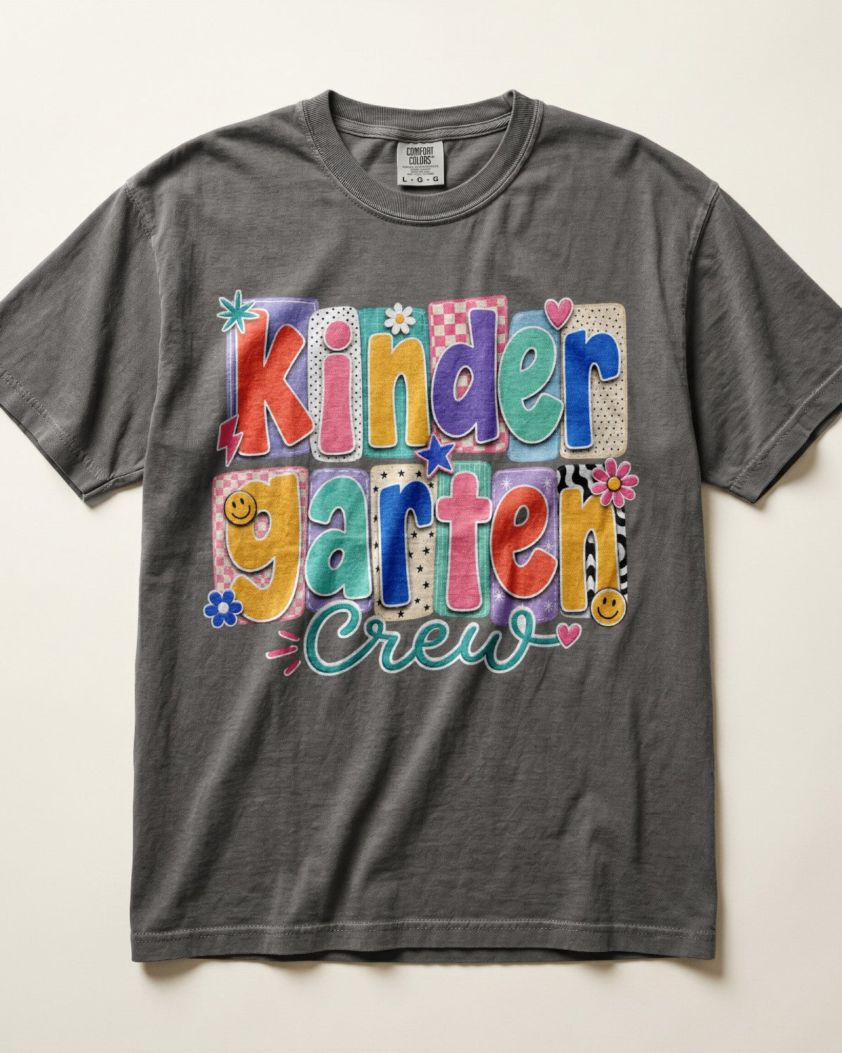 Dark gray crewneck kids T-shirt with “Kinder Garten Crew” colorful graphic print