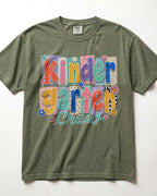 Olive green crewneck kids T-shirt with “Kinder Garten Crew” colorful graphic print