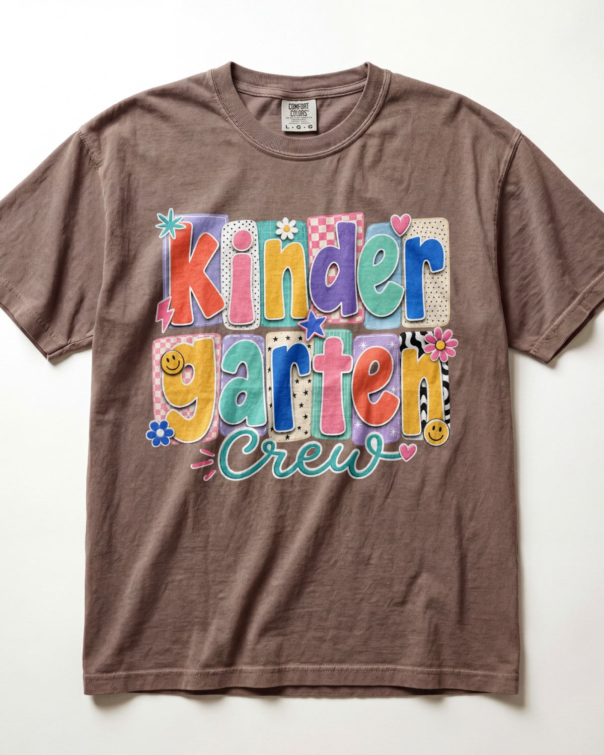 Brown crewneck kids T-shirt with “Kinder Garten Crew” colorful graphic print