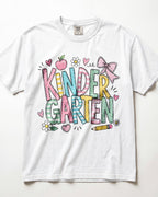 White kindergarten teacher T-shirt with colorful “Kinder Garden” graphic and pencils