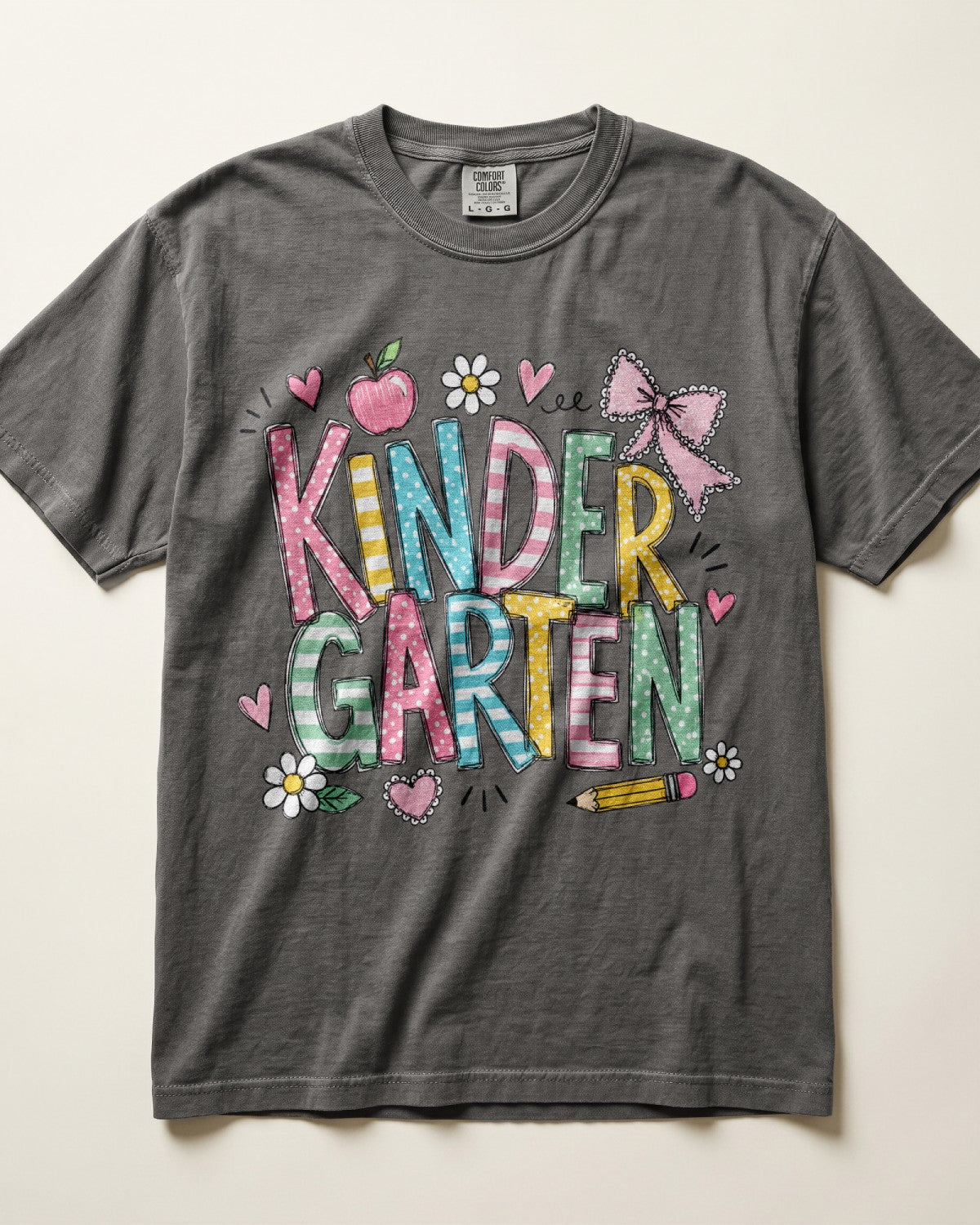 Dark gray kindergarten teacher T-shirt with colorful “Kinder Garden” graphic and pencils