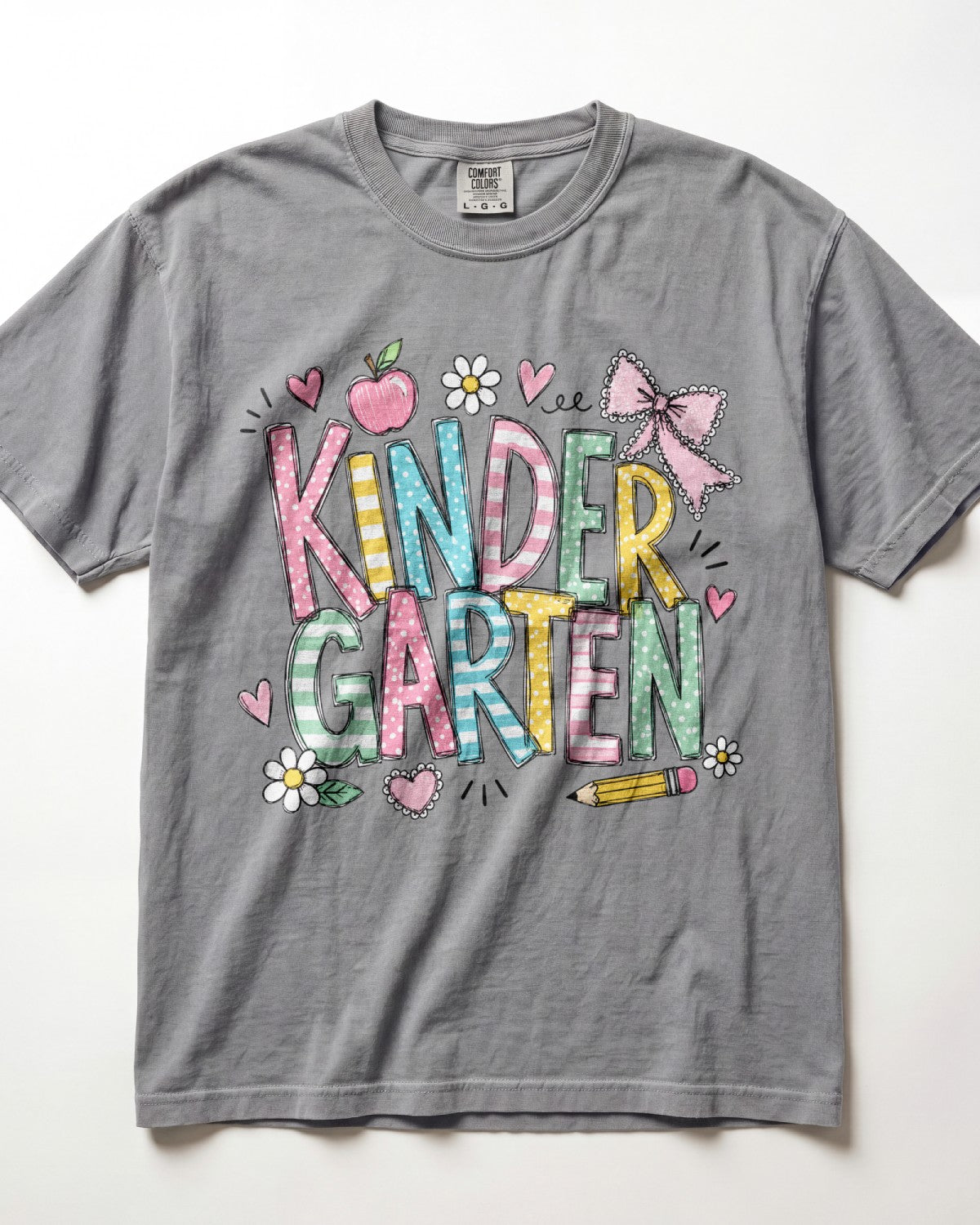 Light gray kindergarten teacher T-shirt with colorful “Kinder Garden” graphic and pencils