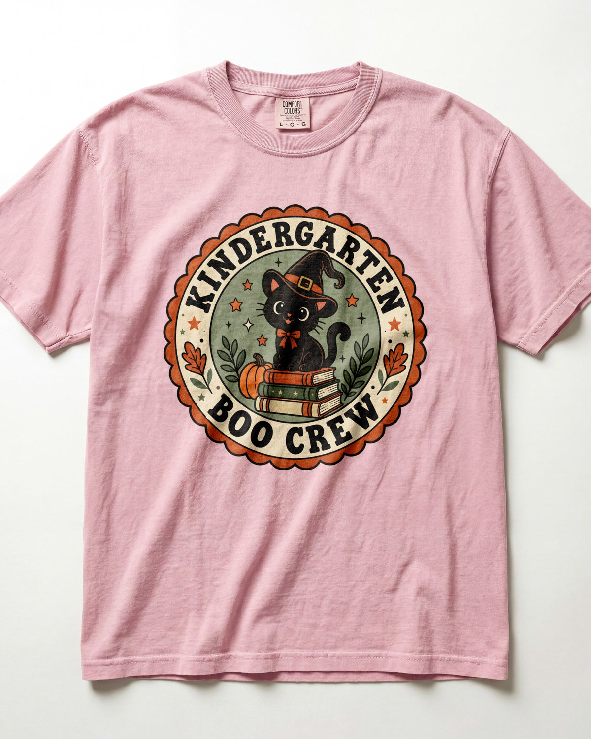 Pink crewneck short-sleeve T-shirt with circular “Boo Crew” kindergarten graphic front