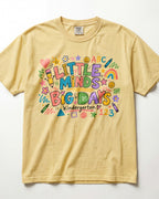 Butter yellow short-sleeve teacher T-shirt with colorful ABC/123 classroom graphic