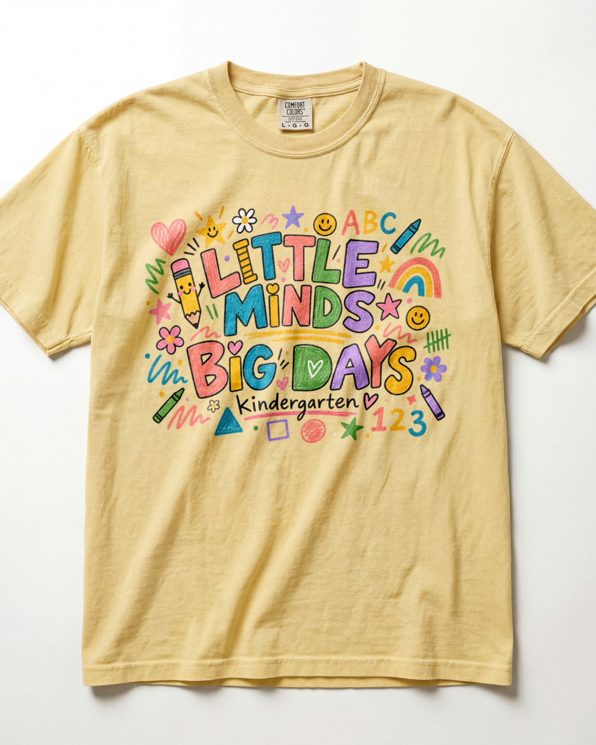 Butter yellow short-sleeve teacher T-shirt with colorful ABC/123 classroom graphic