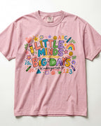 Pink short-sleeve teacher T-shirt with colorful ABC/123 classroom graphic