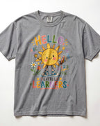 A grey short-sleeve t-shirt with a colorful graphic of a smiling sun character and the text 'HELLO! LITTLE LEARNERS' on the front, displayed flat against a white background.