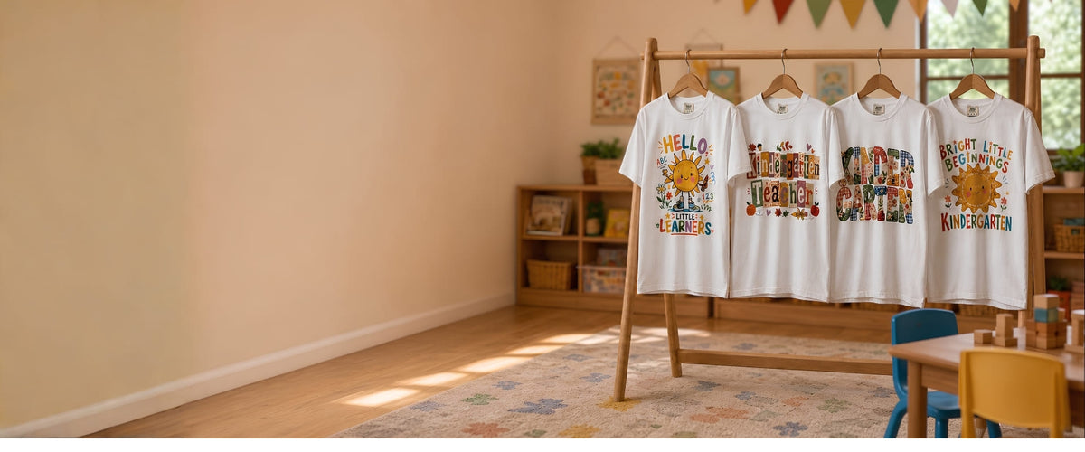 New arrival kindergarten teacher t-shirts hanging on display in a classroom setting